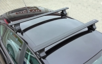 Багажник на крышу Thule Wing bar Black аэродинамический черный для DAEWOO Lanos 4d седан (97-03) за дверной проем
